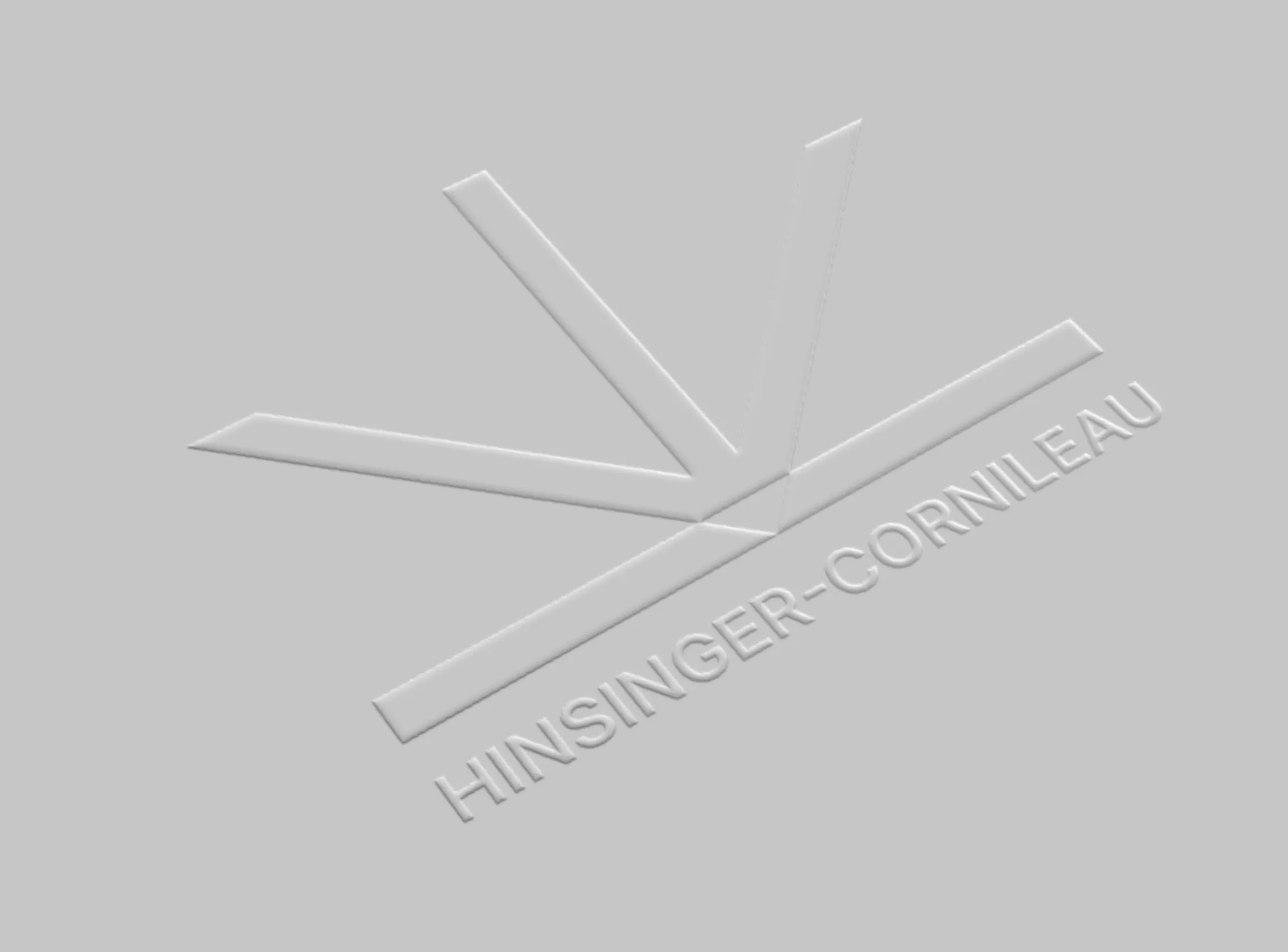 Le logo Hinsinger-Cornileau embossé en relief sur un papier gris clair